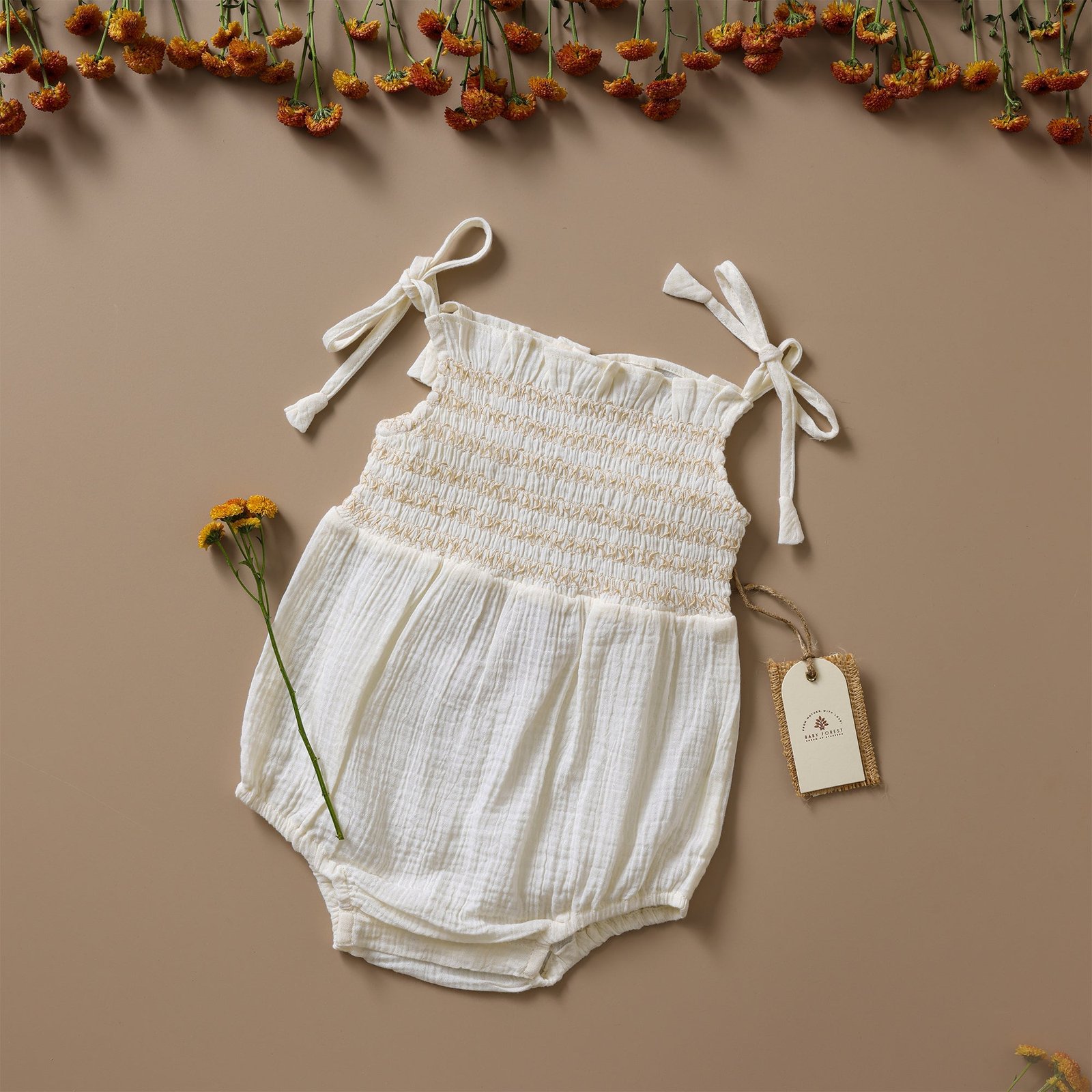 1_d2083c1b-b55c-4e60-a9ea-a781b7f54242.jpg Poshaak Smocked Embroidery Baby Girl Bodysuit - Off-White - Image 1